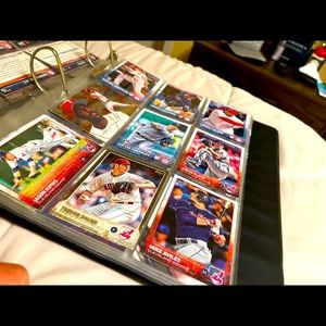 150+ baseball cards with card holding book